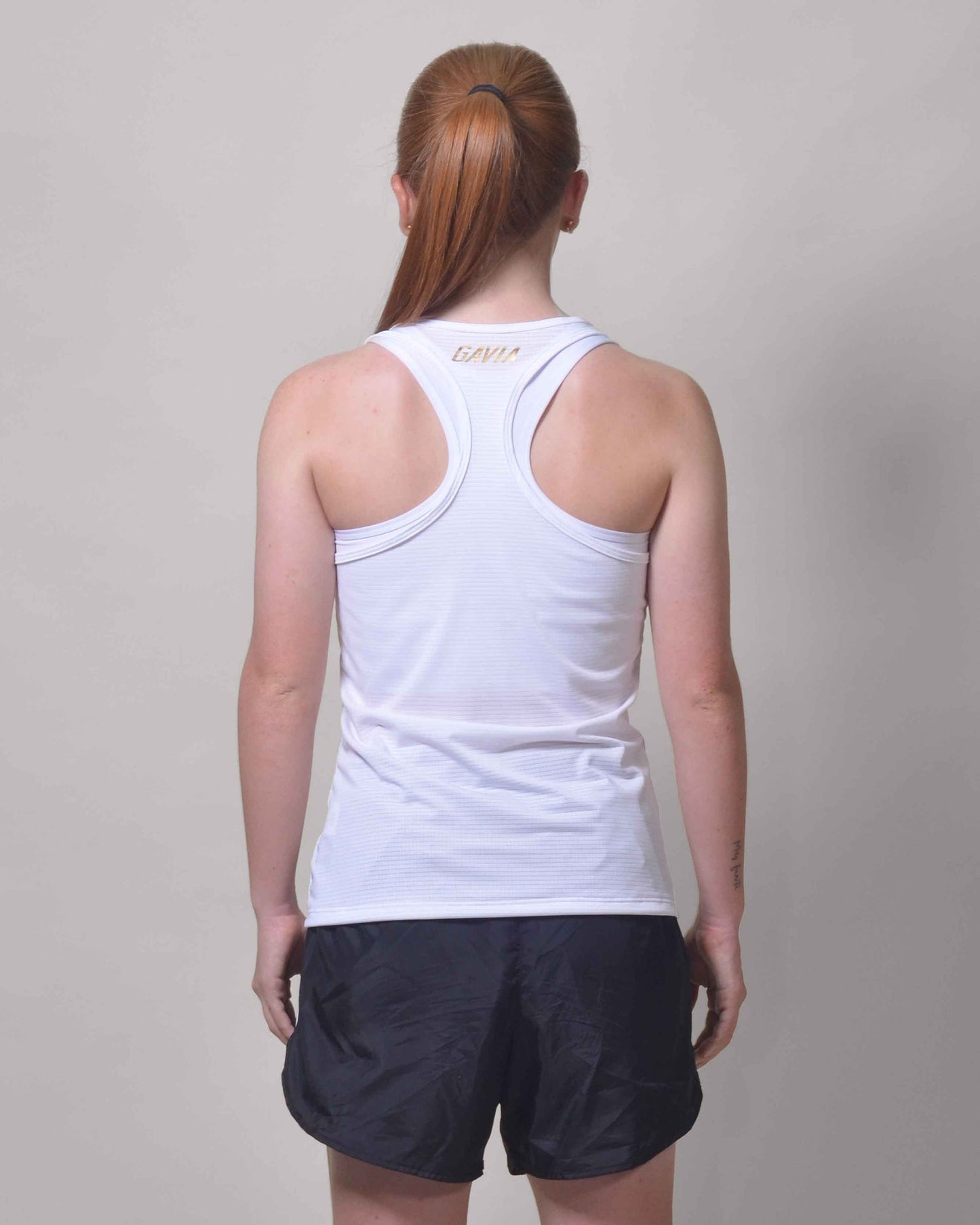 Polera Running Gavia Skipe - Camiseta de correr sin mangas. Mujer (Blanco)