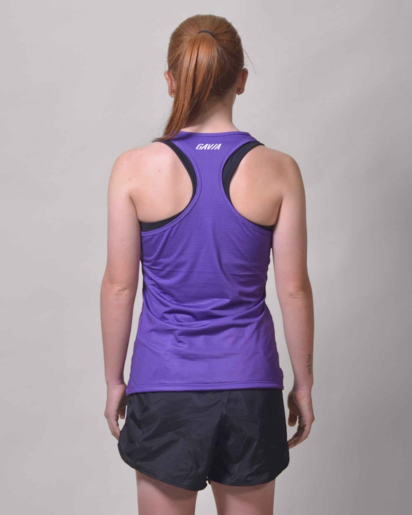 Polera Running Gavia Skipe - Camiseta de correr sin mangas. Mujer (Morado)