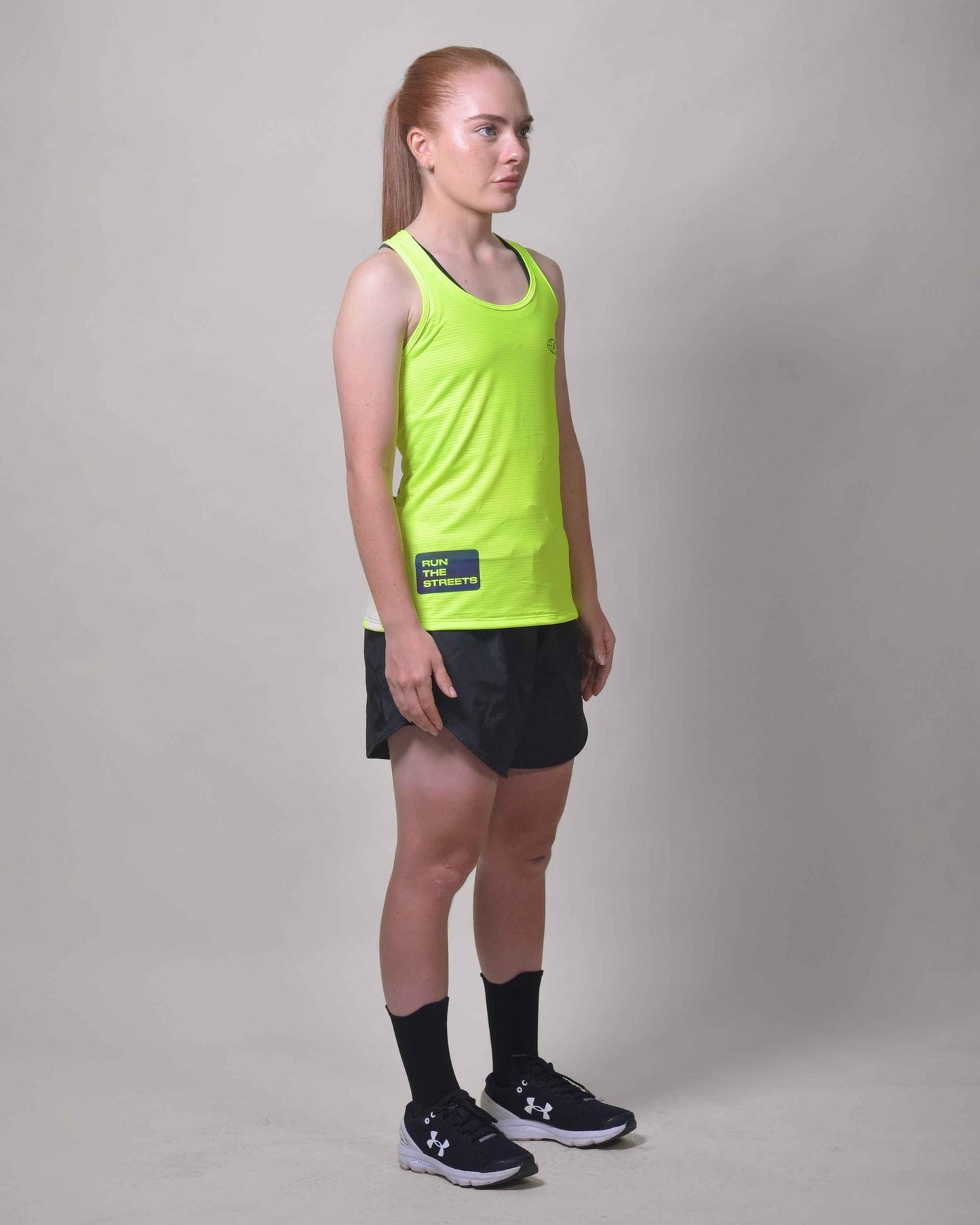 Polera Running Gavia Flow Green - Camiseta de correr sin mangas. Mujer (Amarillo)