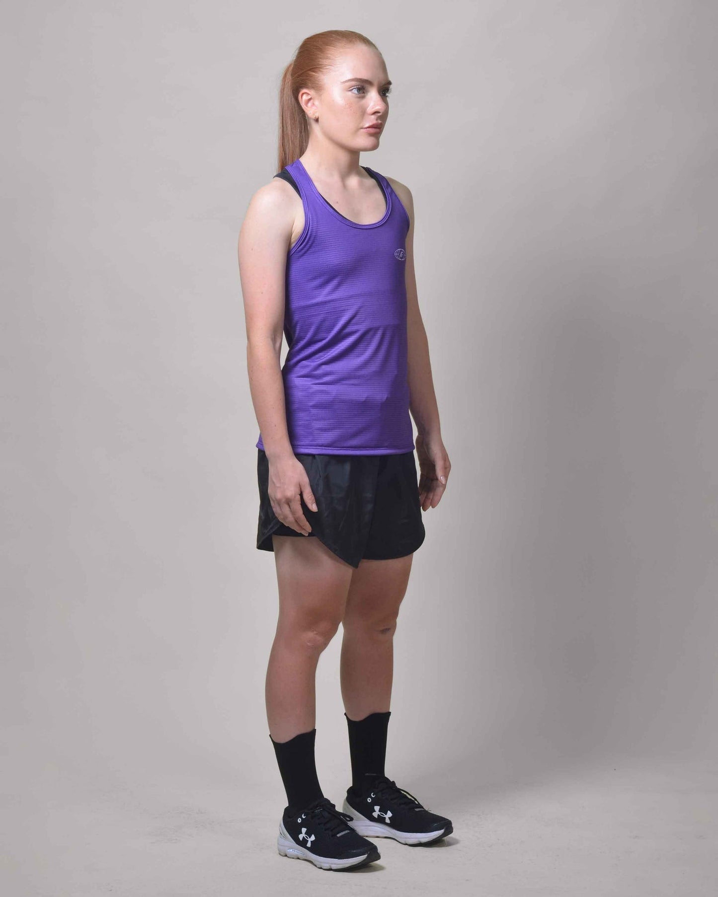 Polera Running Gavia Skipe - Camiseta de correr sin mangas. Mujer (Morado)