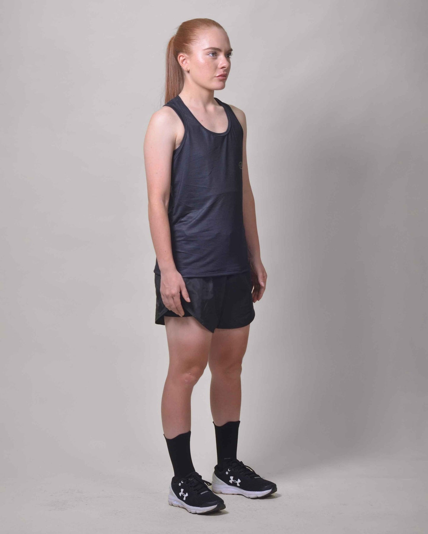 Polera Running Gavia - Camiseta de correr sin mangas. Mujer (Negro Tiniebla)